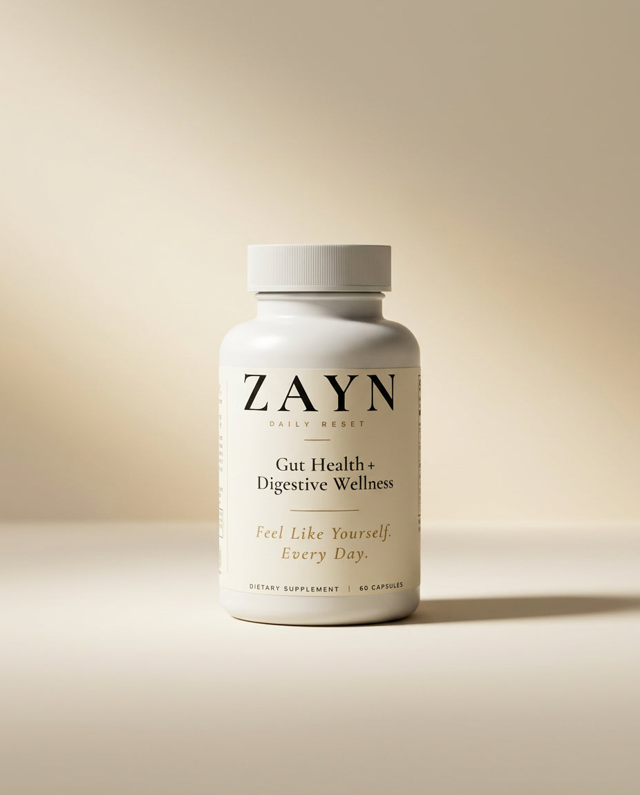 ZAYN Gut Reset bottle on a marble pedestal